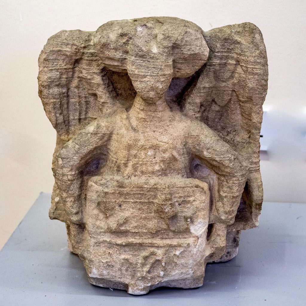 Stone carving of the Eynsham Angel, dating from around the 15th century CE