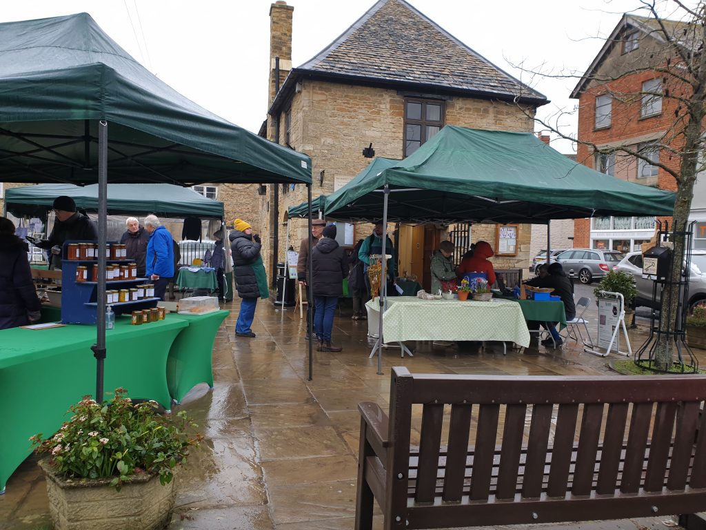 A photo of the weekly Country Market in the Square, taken on a wet Thursday in March 2023
