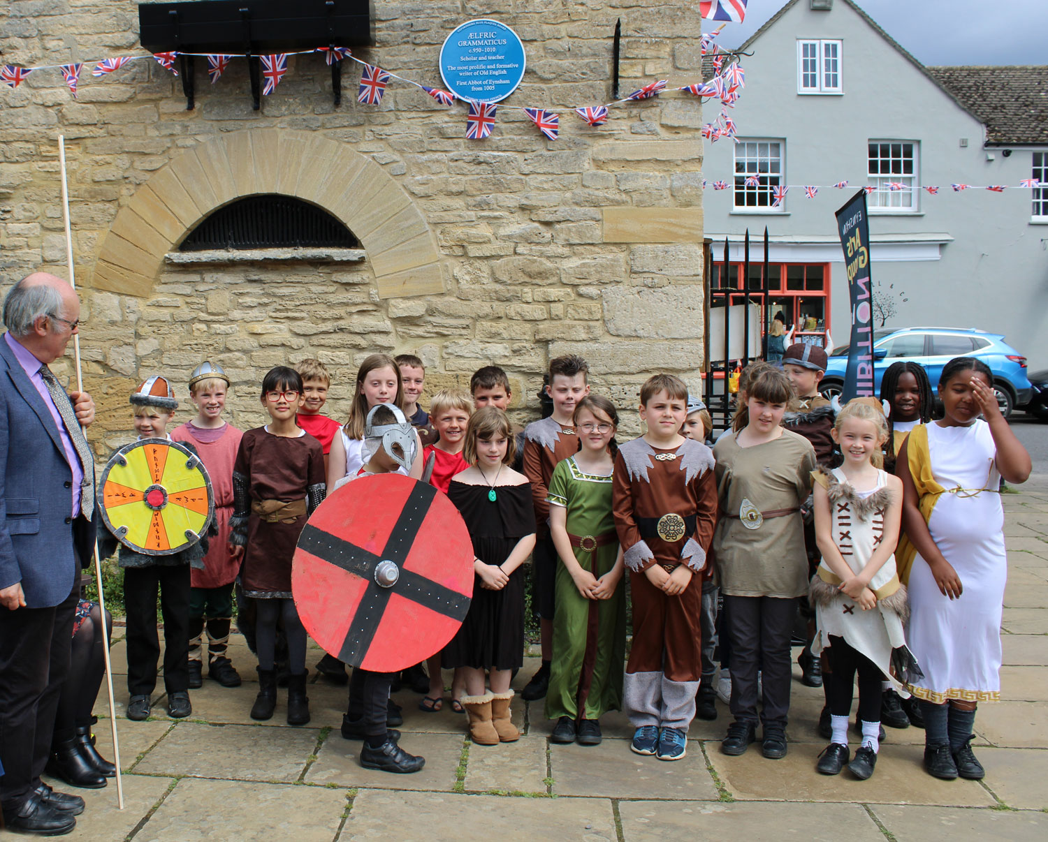 Children from Eynsham Primary School, dressed in medieval costumes, at the unveiling of the Blue Plaque to memorialise Aelfric, first Abbot of Eynsham.