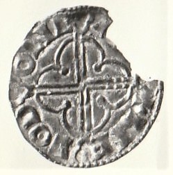 Quatrefoil silver penny of King Cnut (1016-35), Exeter mint. Found at the site of Eynsham Abbey.  A chunk of the coin is missing from the top right quadrant.