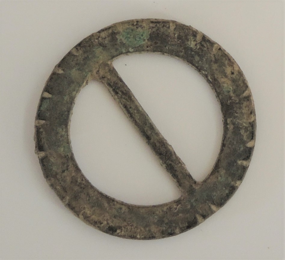 A copper alloy buckle dating from the 17th century and discovered in the wall of the Eynsham Coop in 2014.