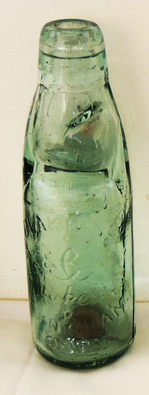 A green glass Codd bottle from the Eynsham mineral water factory Blake & Co