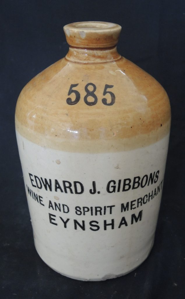 Stoneware jar printed with the letters 585 and the text 'Edward J. Gibbons Wine and Spirit Merchants Eynsham'