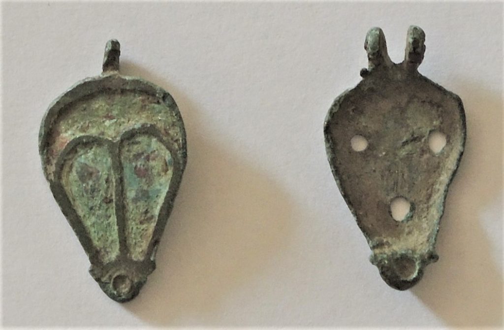 A metallic Roman seal box in two parts.