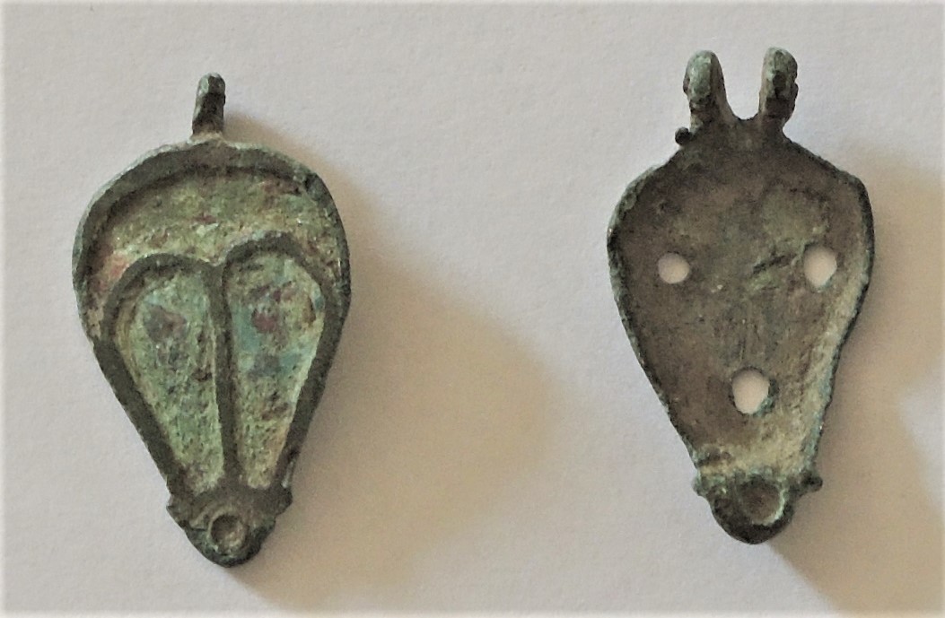 A metallic Roman seal box in two parts.